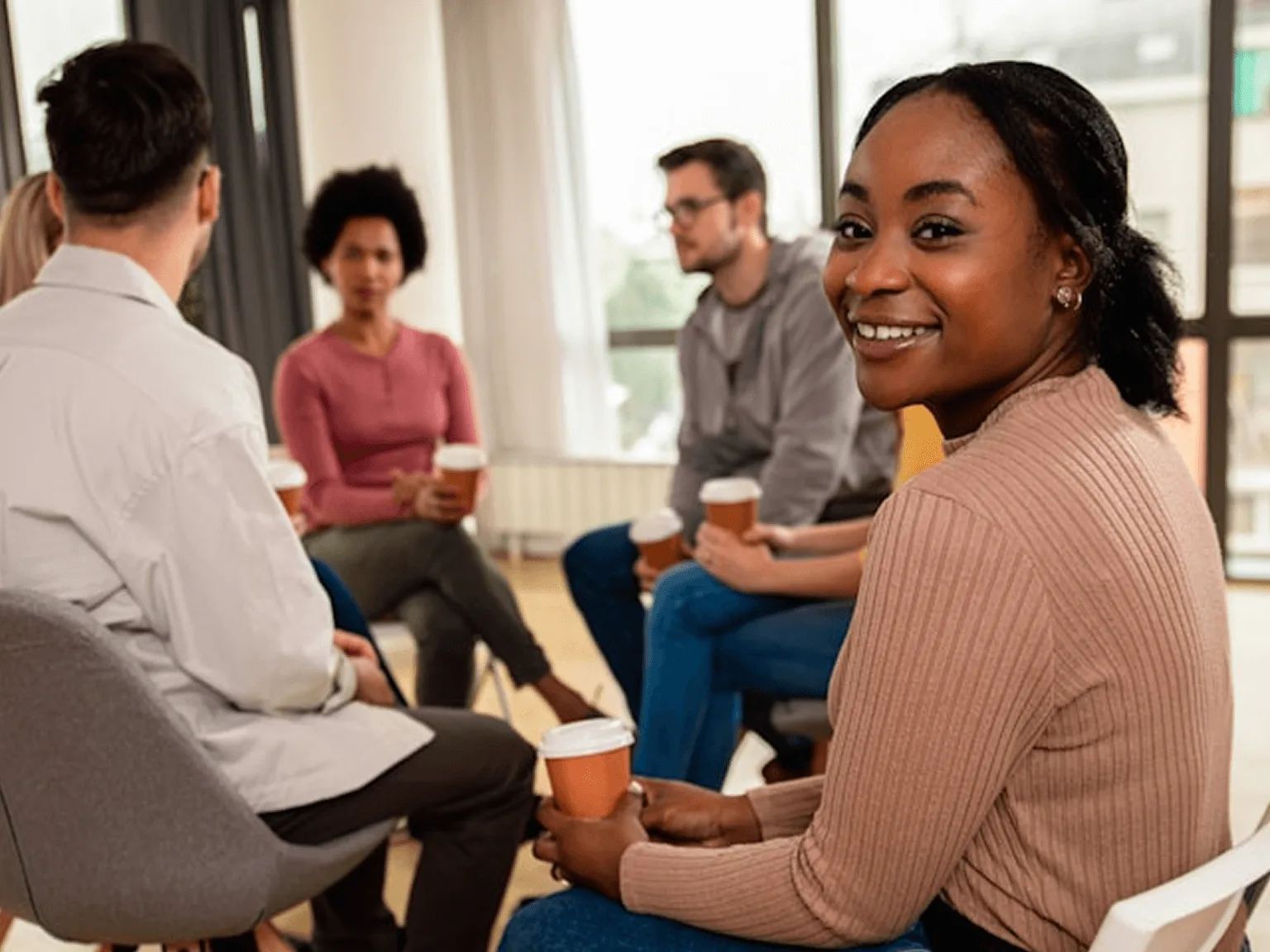 Group discussion girl looks at camera