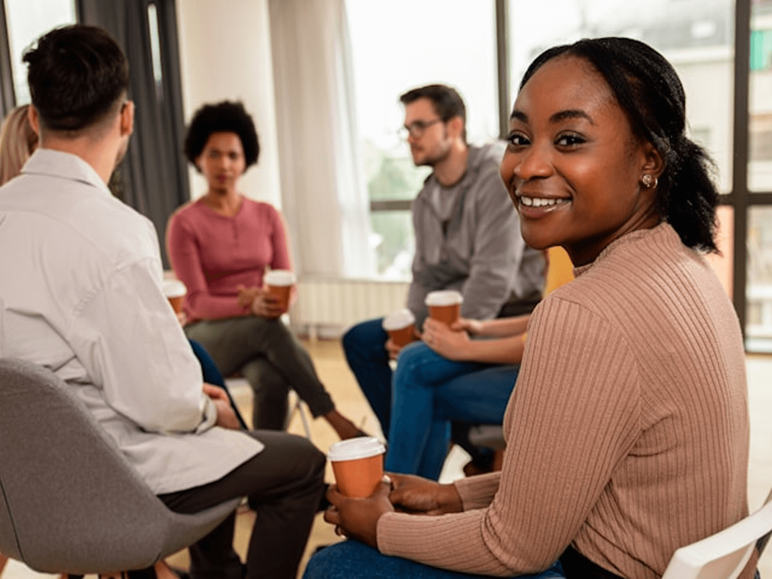 Group discussion girl looks at camera